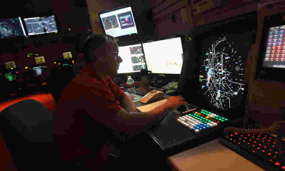 The FAA's partial shutdown doesn't affect air traffic controllers (above). But the impasse has left some 47,000 workers without a paycheck.
