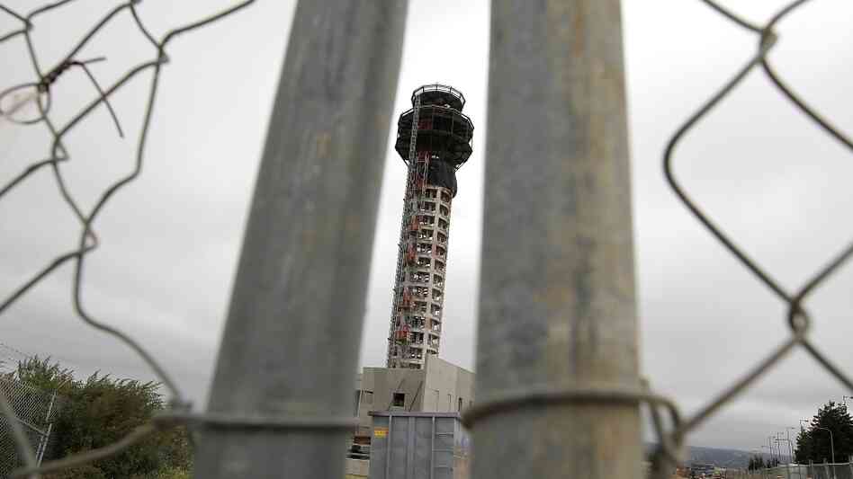 A fence secures the perimeter of a half-completed 236-foot FAA control tower at Oakland International Airport. Construction has been halted because of the FAA shutdown. A fence secures the perimeter of a half-completed 236-foot FAA control tower at Oakland International Airport. Construction has been halted because of the FAA shutdown.
