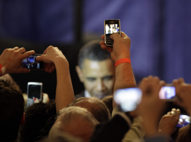 Supporters take photos of President Obama at a fundraising kickoff event in Chicago in April. During the heated debate over the debt ceiling, the president canceled several fundraisers in order to focus on negotiations.