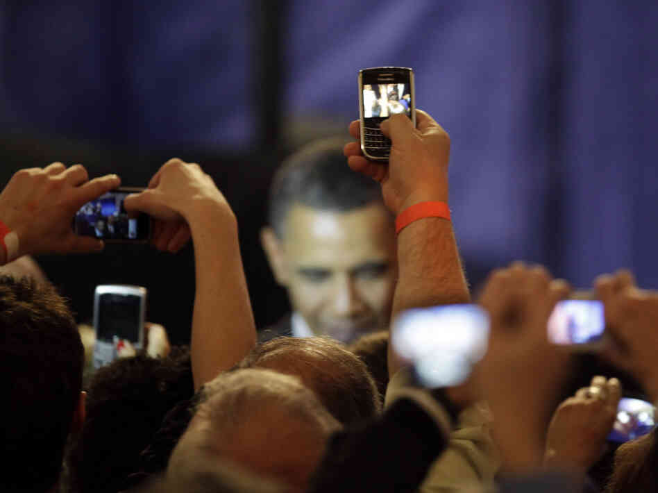 Supporters take photos of President Obama at a fundraising kickoff event in Chicago in April. During the heated debate over the debt ceiling, the president canceled several fundraisers in order to focus on negotiations.