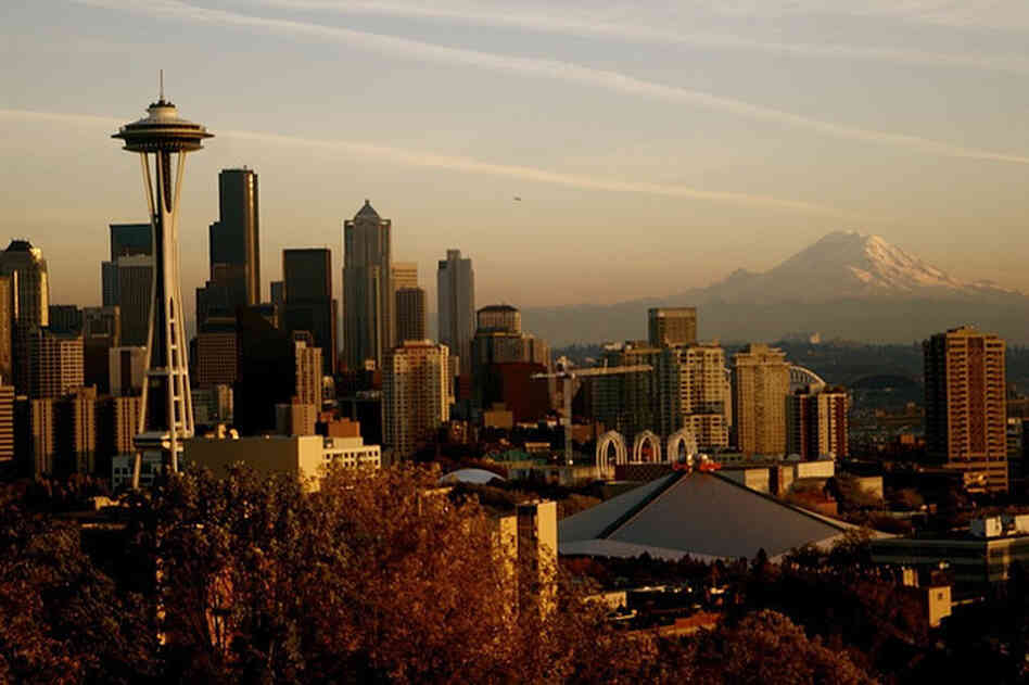 Mount Rainier looms in the background, and the Space Needle (far left) punctuates the city's skyline. Clausen has set three crime novels in Seattle, where he worked as a police officer for 13 years.