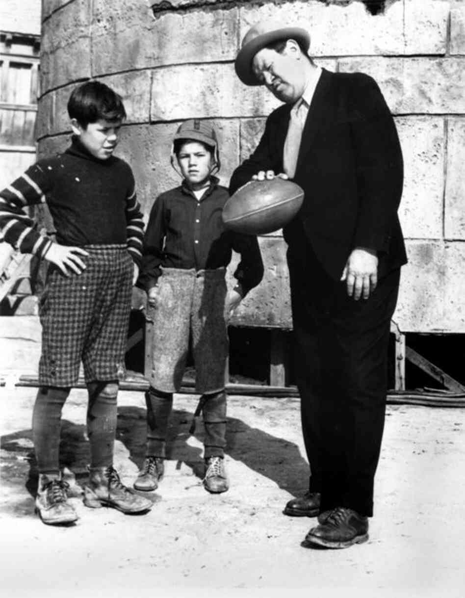 Thorpe (right) gives some passing tips to his sons Phil (left) and Bill on a movie set in Los Angeles in 1940. Desperate to make ends meet after his professional sports career, Thorpe set his sights on Hollywood, where he was often cast in movies as an American Indian. 
