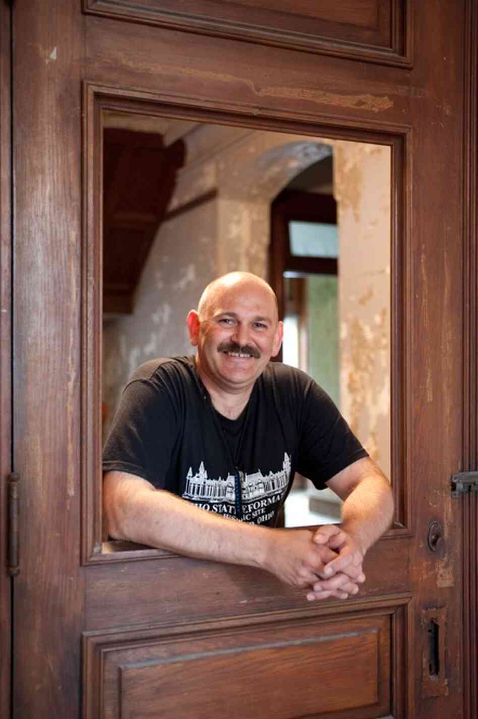 Reformatory tour guide Ron Puff. The filmmakers built this door (and the wall attached to it) so that Tim Robbins' character, Andy Dufresne, could lock himself into an office and play "The Marriage of Figaro" over the prison loudspeaker. Assuming that the Reformatory would be torn down after they left, filmmakers didn't bother to remove the fake wall or door.