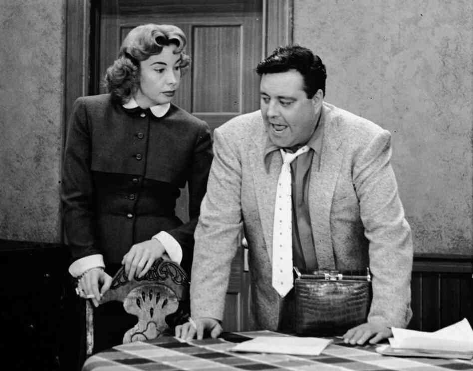 Jackie Gleason (right) played Ralph Kramden — a bumbling but loveable overweight husband — in the 1950s sitcom The Honeymooners. Audrey Meadows co-starred as his wife, Alice.