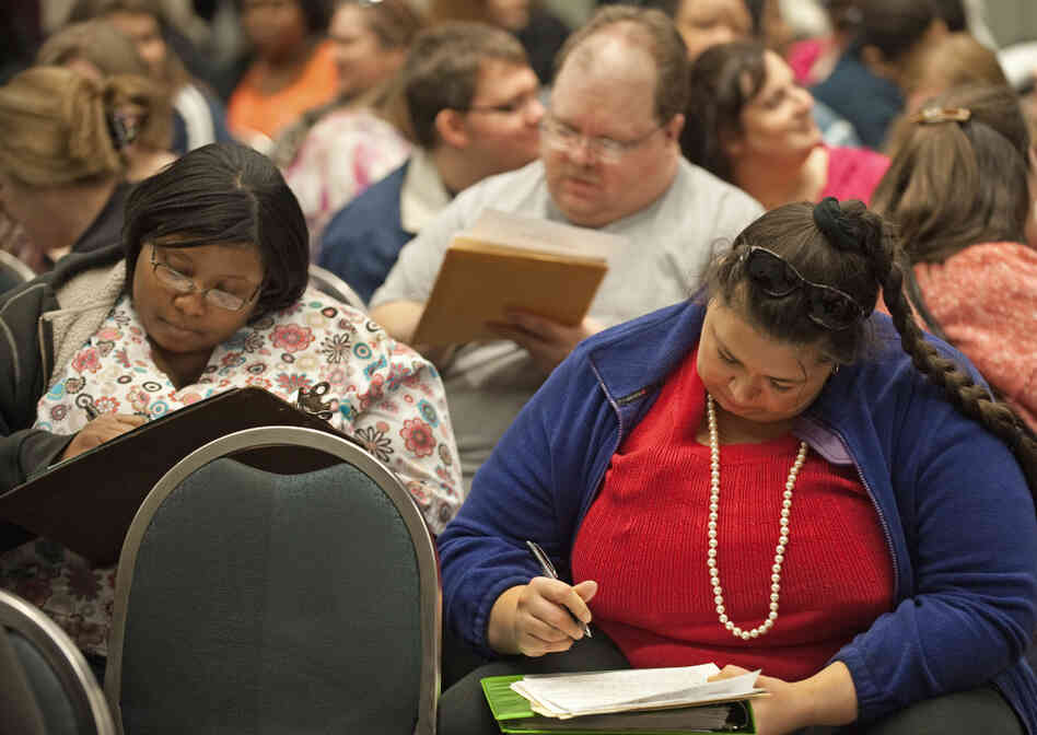 Aspiring contestants fill out applications during an open audition for The Biggest Loser, Season 10. More than 500 people showed up at the D.C. audition, with thousands more applying around the country.