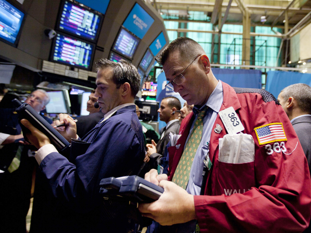 Traders work on the floor of the New York Stock Exchange on Thursday in New York. Stocks are plunging in another broad sell-off as investors grow concerned about an economic slowdown in the U.S. and Europe.