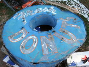 The original sign for Dude's Daylight Donuts had hung on Main Street in Joplin for decades. Here it sits in the public works yard. The original sign for Dude's Daylight Donuts had hung on Main Street in Joplin for decades. Here it sits in the public works yard.