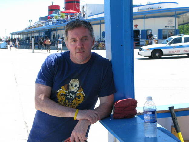 Michael Harvey poses in front of the Castaways Bar and Grill at Chicago's North Avenue Beach. Investigator Kelly often visits the lakefront to clear his mind on the its running paths.