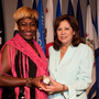 Lisa Bolling accepts the "Challenge Coin" from Secretary of Labor Hilda L. Solis at Arlington National Cemetery's Women in Military Service for America Memorial on July 20. The secretary shared Bolling's story of being a homeless female veteran at the launch of a new trauma guide for women. Lisa Bolling accepts the "Challenge Coin" from Secretary of Labor Hilda L. Solis at Arlington National Cemetery's Women in Military Service for America Memorial on July 20. The secretary shared Bolling's story of being a homeless female veteran at the launch of a new trauma guide for women.
