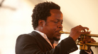 Ambrose Akinmusire performs with his quintet on the Harbor Stage during the Newport Jazz Festival. Ambrose Akinmusire performs with his quintet on the Harbor Stage during the Newport Jazz Festival.