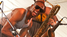 Trombone Shorty, with Dan Oestreicher on baritone saxophone in the background, performing at the Newport Jazz Festival on Saturday. Trombone Shorty, with Dan Oestreicher on baritone saxophone in the background, performing at the Newport Jazz Festival on Saturday.