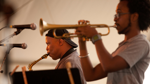 Steve Coleman performs with Five Elements, including Jonathan Finlayson (on trumpet, foreground), on the Harbor Stage at the Newport Jazz Festival.