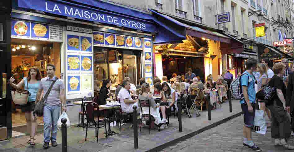 Restaurants line a street of the Quartier Latin in central Paris.