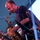 Dan Willis, on tenor saxophone, performs with the John Hollenbeck Large Ensemble on the Quad Stage during the Newport Jazz Festival. Dan Willis, on tenor saxophone, performs with the John Hollenbeck Large Ensemble on the Quad Stage during the Newport Jazz Festival.