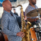 Joshua Redman, on saxophone, and Eric Harland, on drums, perform as half of James Farm on the Fort Stage during the Newport Jazz Festival.