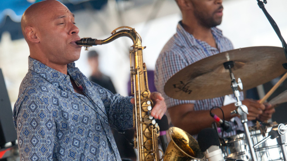 Joshua Redman, on saxophone, and Eric Harland, on drums, perform as half of James Farm on the Fort Stage during the Newport Jazz Festival.