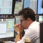 A broker watches screens displaying the German stock index DAX at the stock market in Frankfurt, Germany, on Monday, where the stock index fell after the opening of trading. A broker watches screens displaying the German stock index DAX at the stock market in Frankfurt, Germany, on Monday, where the stock index fell after the opening of trading.