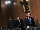 Federal Reserve Board Chairman Ben Bernanke may look to reassure global financial markets Tuesday. Here, he arrives for a Senate Banking, Housing, and Urban Affairs Committee hearing in July. Federal Reserve Board Chairman Ben Bernanke may look to reassure global financial markets Tuesday. Here, he arrives for a Senate Banking, Housing, and Urban Affairs Committee hearing in July.