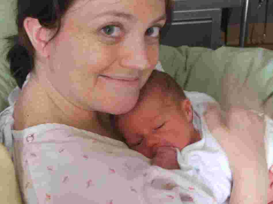 Lucy holds her newborn son, Dexter.
