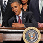 President Obama signs the financial reform bill into law in 2010 as Vice President Biden and lawmakers look on. President Obama signs the financial reform bill into law in 2010 as Vice President Biden and lawmakers look on.