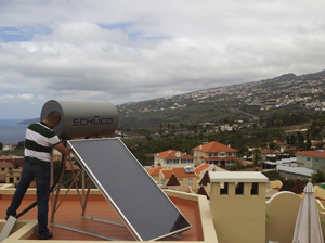 A worker installs a solar panel on the roof of a house in Santa Cruz de Tenerife in the Spanish Canary Island of Tenerife in March 2011. The country's solar sector intends to double its contribution to the national grid by 2020, after an earlier government attempt at boosting the industry failed. A worker installs a solar panel on the roof of a house in Santa Cruz de Tenerife in the Spanish Canary Island of Tenerife in March 2011. The country's solar sector intends to double its contribution to the national grid by 2020, after an earlier government attempt at boosting the industry failed.