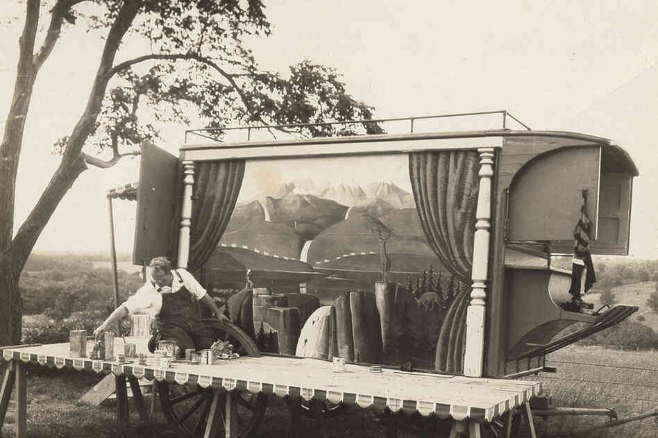 Grant Wood putting the finishing touches on his ice wagon in Stone City, Iowa, circa 1933 