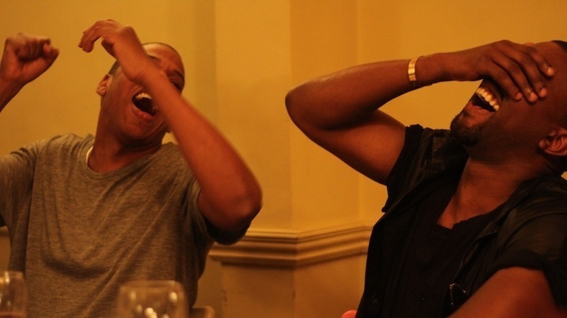 Jay-Z and Kanye West, laughing, from a series of photos on Jay-Z's web site taken during the making of Watch the Throne.
