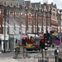 Firemen hosed down an area of Clapham, South London, on Tuesday after another night of violence left trails of looted stores, wrecked cars and burned buildings across London and several other cities.
