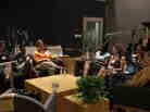 Adam Graham (from left to right), Tanae Foglia, Kelly Hruska, Stacey Ferguson, Corie Driscoll, Angela Tilghman and Sharon Johnson participate in a round-table discussion about parenting hosted by Michele Norris at NPR's headquarters in Washington, D.C.