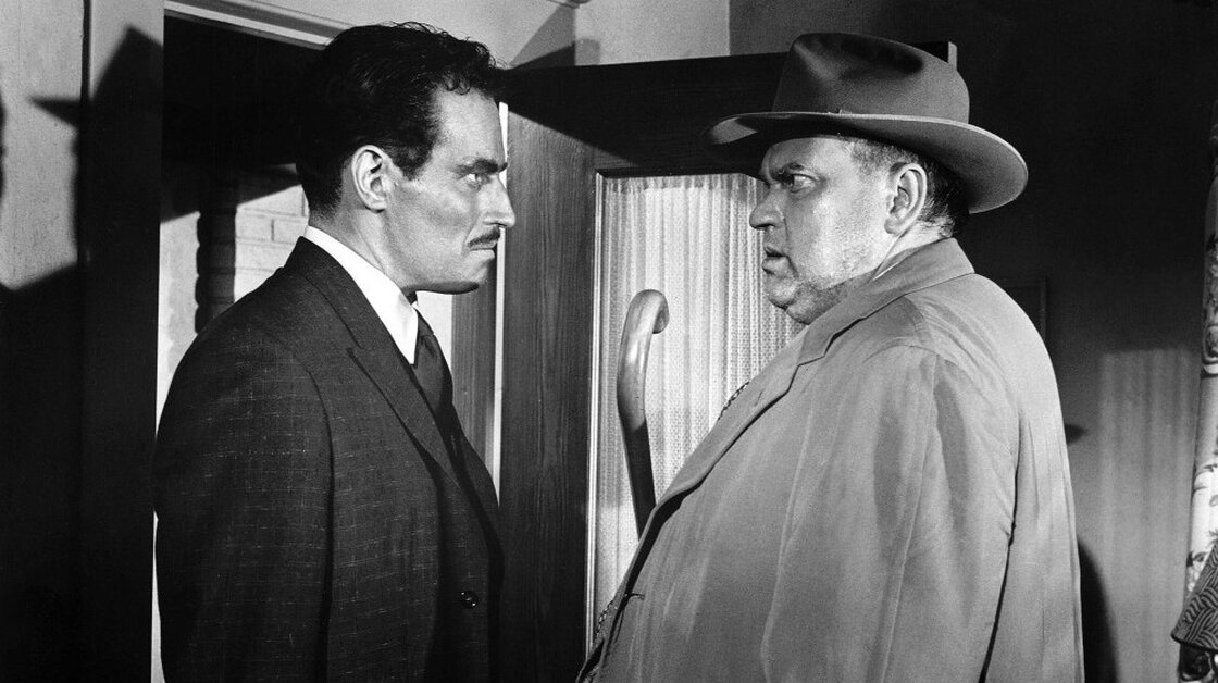 Charlton Heston (left) as Miguel Vargas and Orson Welles as Hank Quinlan in Touch of Evil Charlton Heston (left) as Miguel Vargas and Orson Welles as Hank Quinlan in Touch of Evil