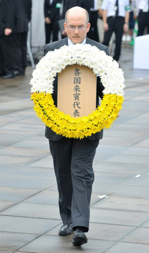 James Zumwalt, deputy chief of the U.S. embassy in Tokyo, offers a wreath of flowers at a ceremony marking the 66th anniversary of the bombing of Nagasaki. James Zumwalt, deputy chief of the U.S. embassy in Tokyo, offers a wreath of flowers at a ceremony marking the 66th anniversary of the bombing of Nagasaki.