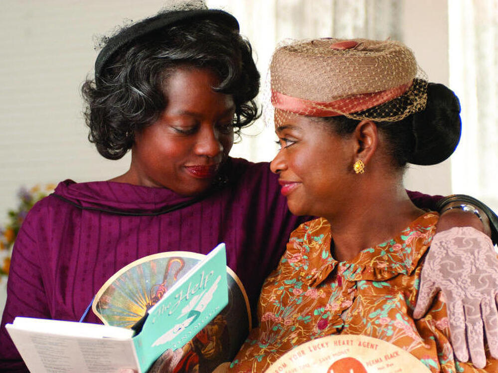 Best friends Aibileen Clark (Viola Davis, left) and Minny Jackson (Octavia Spencer, right) share a special moment in "The Help."