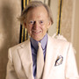 Author Tom Wolfe poses in one of his trademark three-piece suits.