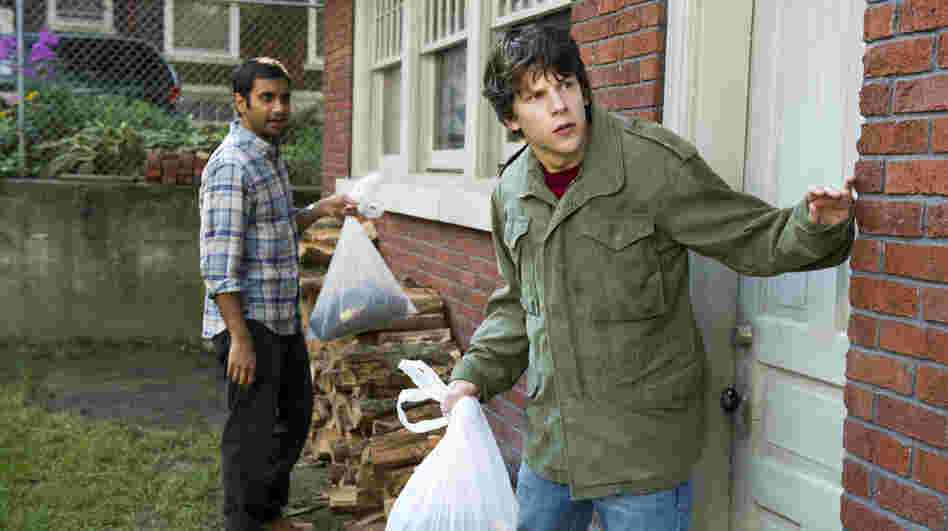 Totally Trashed: Nick (Jesse Eisenberg, right) enlists his best friend Chet (Aziz Ansari) to help him rob a bank after two dim-witted criminals strap a bomb to his chest. Though the pizza-delivery man who inspired the film died in real life, director Ruben Fleischer opts for a lighthearted (and sloppy) approach to the story. Totally Trashed: Nick (Jesse Eisenberg, right) enlists his best friend Chet (Aziz Ansari) to help him rob a bank after two dim-witted criminals strap a bomb to his chest. Though the pizza-delivery man who inspired the film died in real life, director Ruben Fleischer opts for a lighthearted (and sloppy) approach to the story.