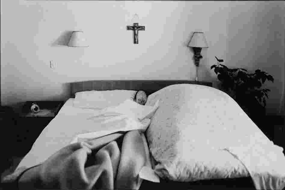 The Widow still makes the bed every day on her husband's side.