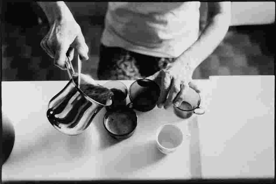 The Widow preparing coffee, an everyday ritual; through wonderfully scented coffee she shares her love with her offspring.