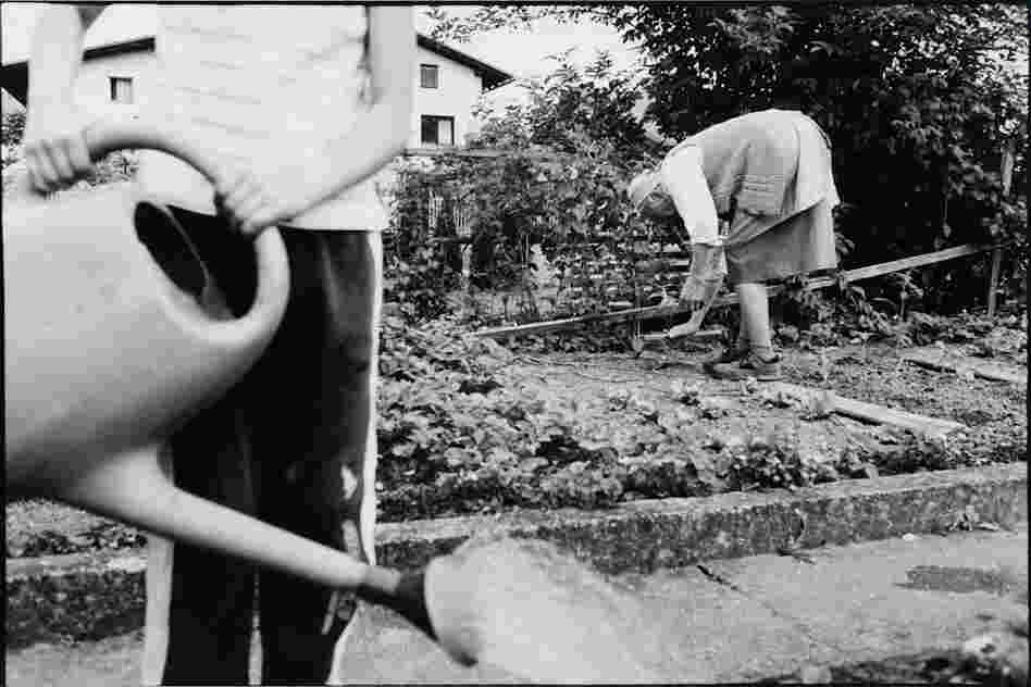The Widow passing on her gardening skills to Jera, her granddaughter.