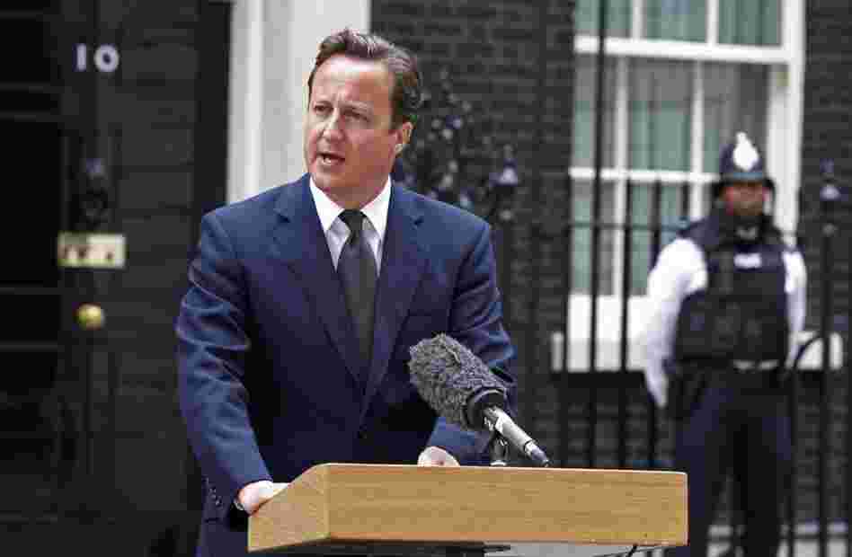 British Prime Minister David Cameron addresses the media in London on Aug. 8. Cameron announced the recall of Parliament from its summer recess to deal with the crisis. 