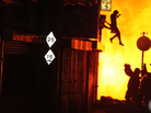 After hearing people shout that a woman was about to jump from a burning building, photographer Amy Weston snapped this image of the woman's leap to safety. After hearing people shout that a woman was about to jump from a burning building, photographer Amy Weston snapped this image of the woman's leap to safety.