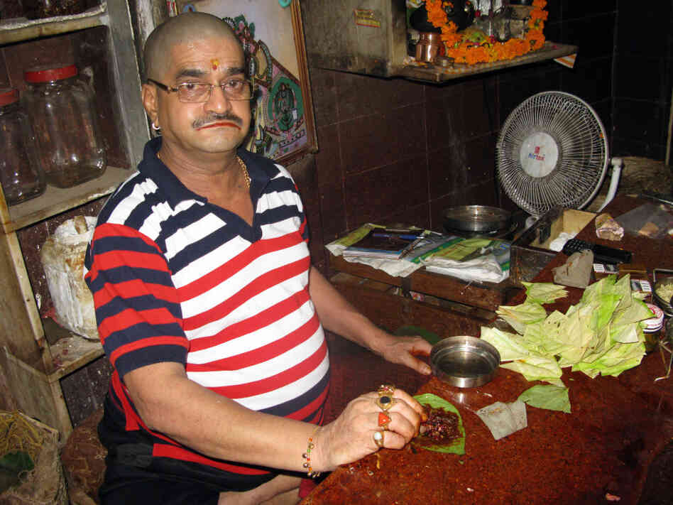 Paan seller Jitender Verma sits in his shop in old Delhi's Chandni Chowk market. He has been making and selling paan in this family business for 40 years, but now faces competition from a cheap form of chewing tobacco. Paan seller Jitender Verma sits in his shop in old Delhi's Chandni Chowk market. He has been making and selling paan in this family business for 40 years, but now faces competition from a cheap form of chewing tobacco.