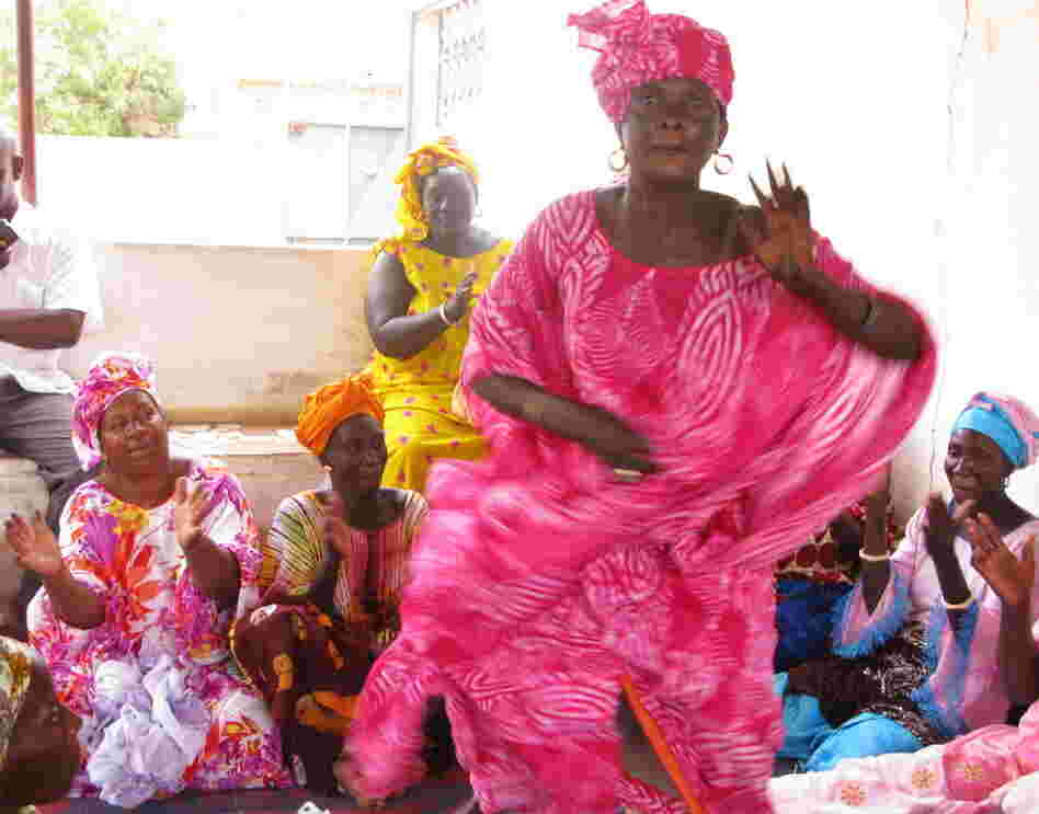 Lightening the mood, the otherwise serious health care proceedings are  punctuated by song and dance.