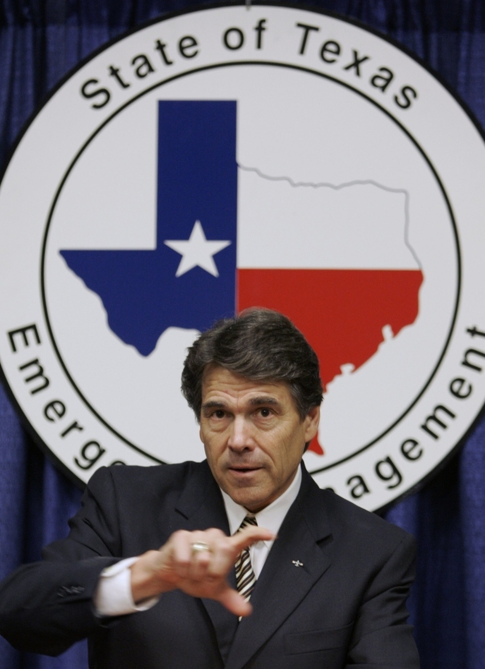 Texas Gov. Rick Perry answers questions following a speech at the Texas Homeland Security conference in San Antonio in 2006.
