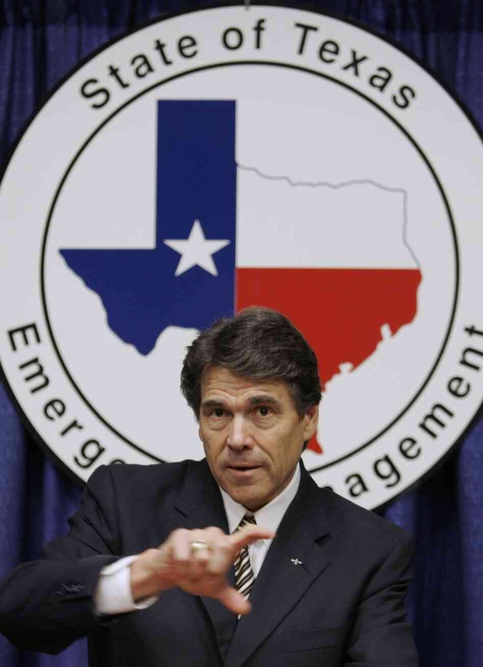 Texas Gov. Rick Perry answers questions following a speech at the Texas Homeland Security conference in San Antonio in 2006.
