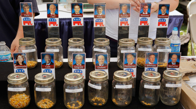 Voters put corn kernels into jars with their favorite Republican presidential candidates on the first day of the Iowa State Fair in Des Moines on Thursday. Voters put corn kernels into jars with their favorite Republican presidential candidates on the first day of the Iowa State Fair in Des Moines on Thursday.