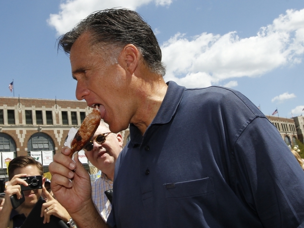 Mitt Romney eats a pork chop on a stick at the Iowa State Fair, Aug. 11, 2011.