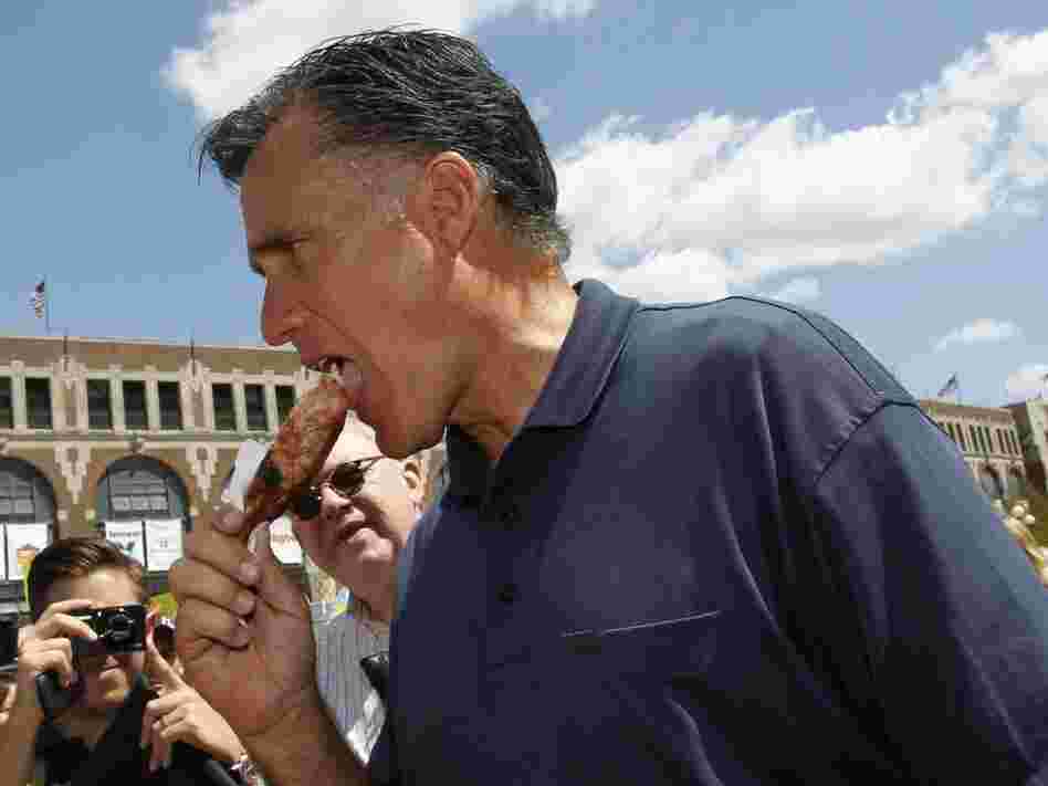 Mitt Romney eats a pork chop on a stick at the Iowa State Fair, Aug. 11, 2011.