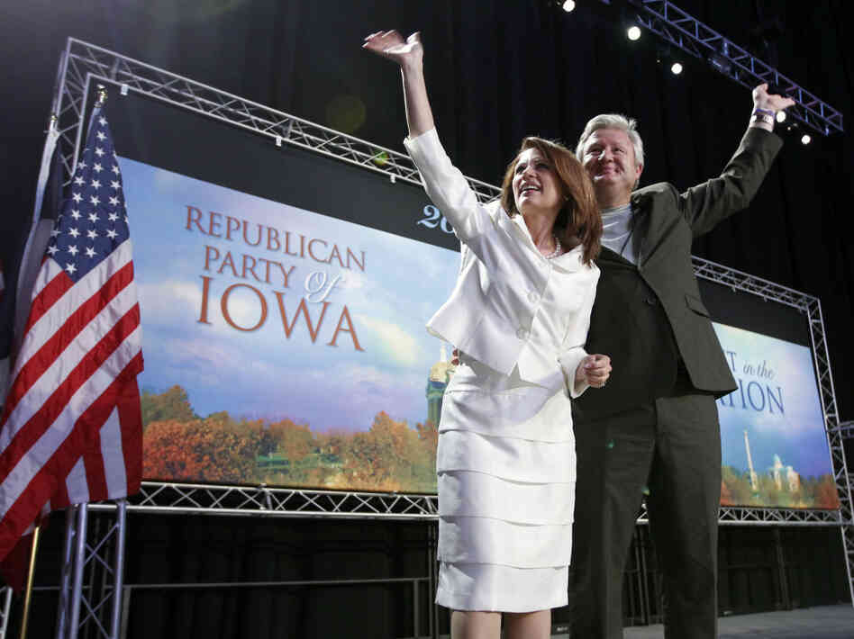 Republican presidential candidate Rep. Michele Bachmann (R-MN) and her husband, Marcus, wave to the crowd after she speaks at the Iowa Republican Party's straw poll in Ames, Iowa, on Saturday. Bachmann won the poll with 4,823 votes.