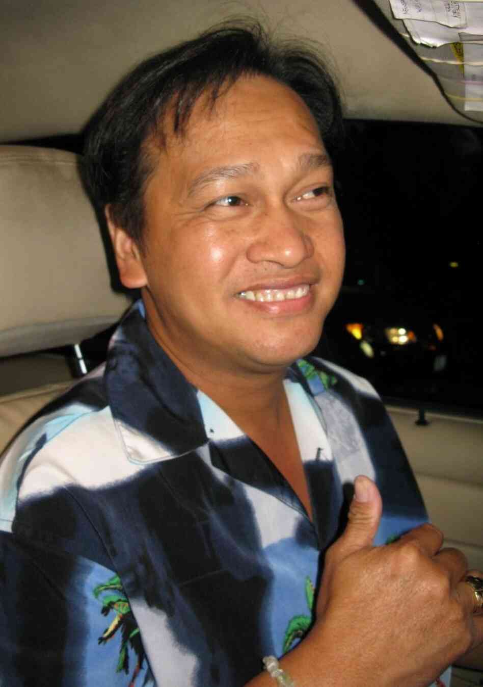 Karaoke cab driver Joel Laguidao has two requirements for his passengers' singing: loud and loud.