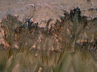 Images from the the HiRISE instrument on the Mars Reconnaissance Orbiter of a cliff in the Newton Crater on Mars. Images from the the HiRISE instrument on the Mars Reconnaissance Orbiter of a cliff in the Newton Crater on Mars.