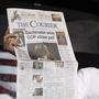 Republican presidential candidate Rep. Michele Bachmann, R-Minn., holds up a newspaper saying that she won the GOP Straw Poll as she speaks at the Black Hawk County Republican Party Lincoln Day Dinner in Waterloo, Iowa, Sunday, Aug. 14, 2011. (AP Photo/Charles Dharapak)